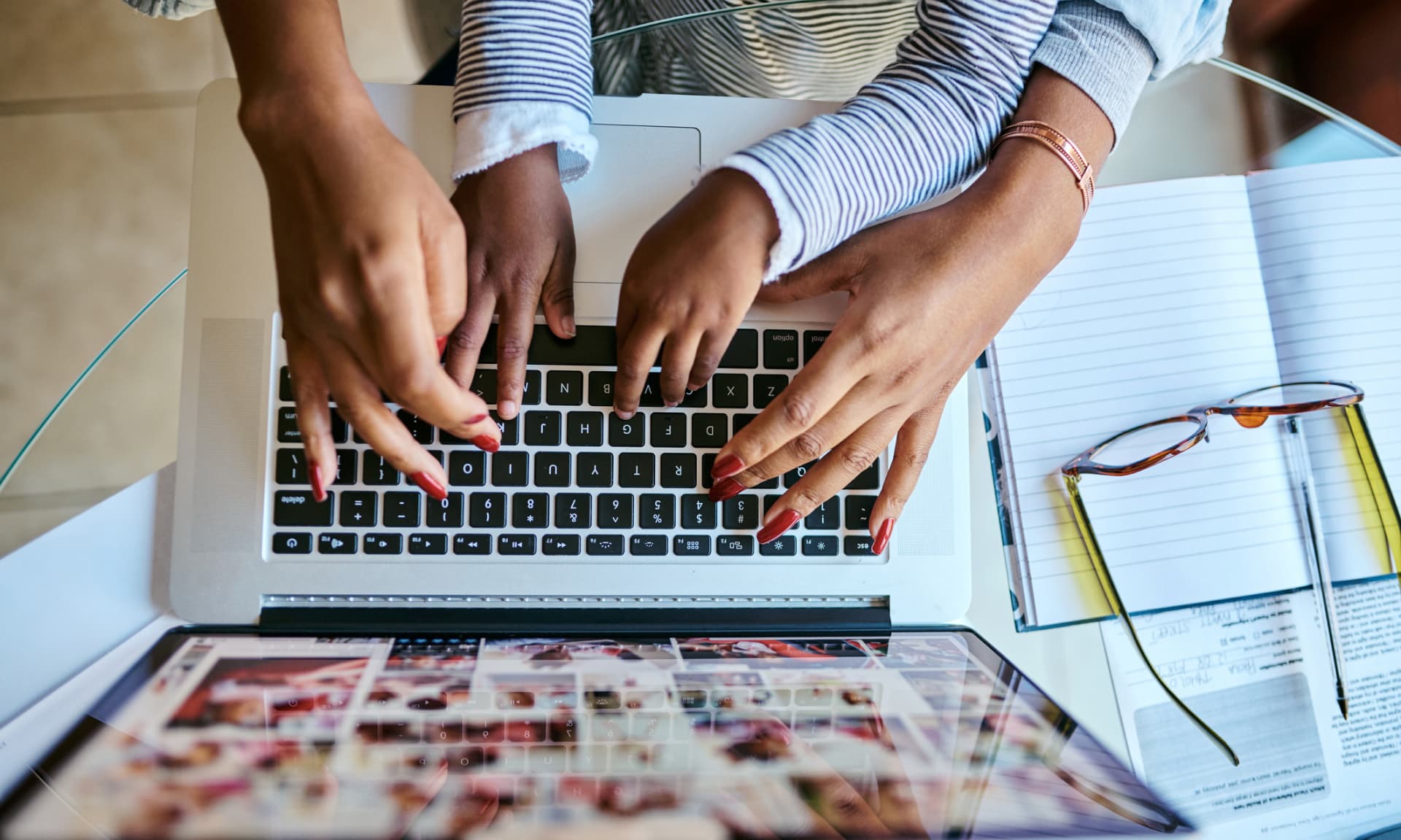 woman and child's hands on keyboard