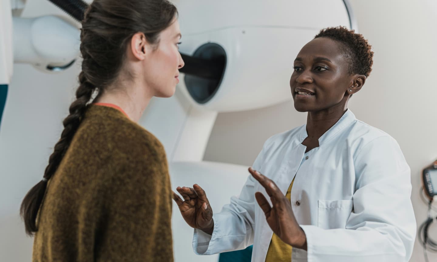 woman speaking to her doctor in the doctor's office