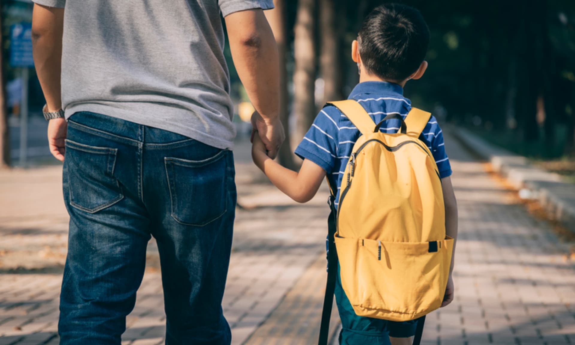 kid holding dad's hand