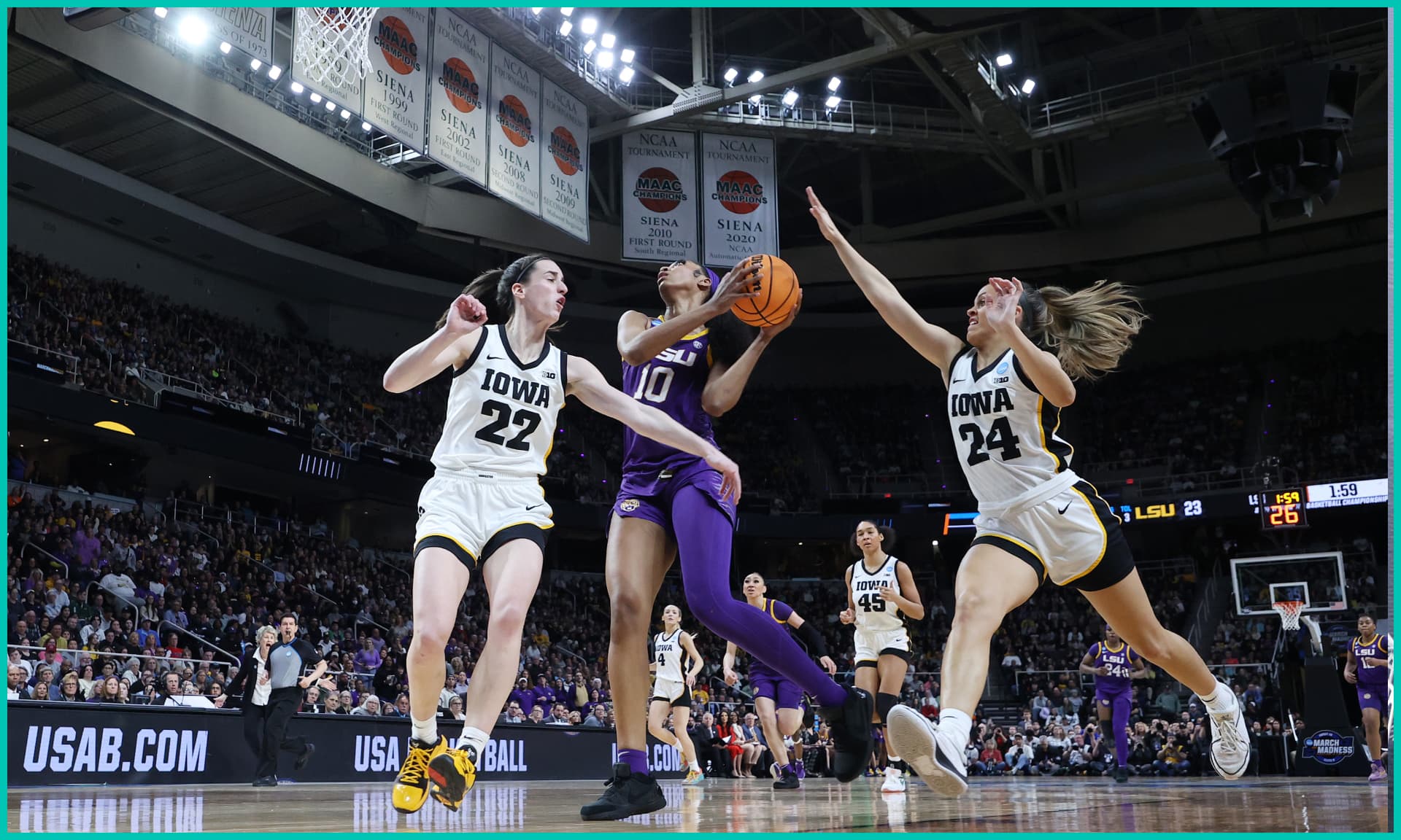 Angel Reese #10 of the LSU Tigers shoots the ball over Caitlin Clark #22