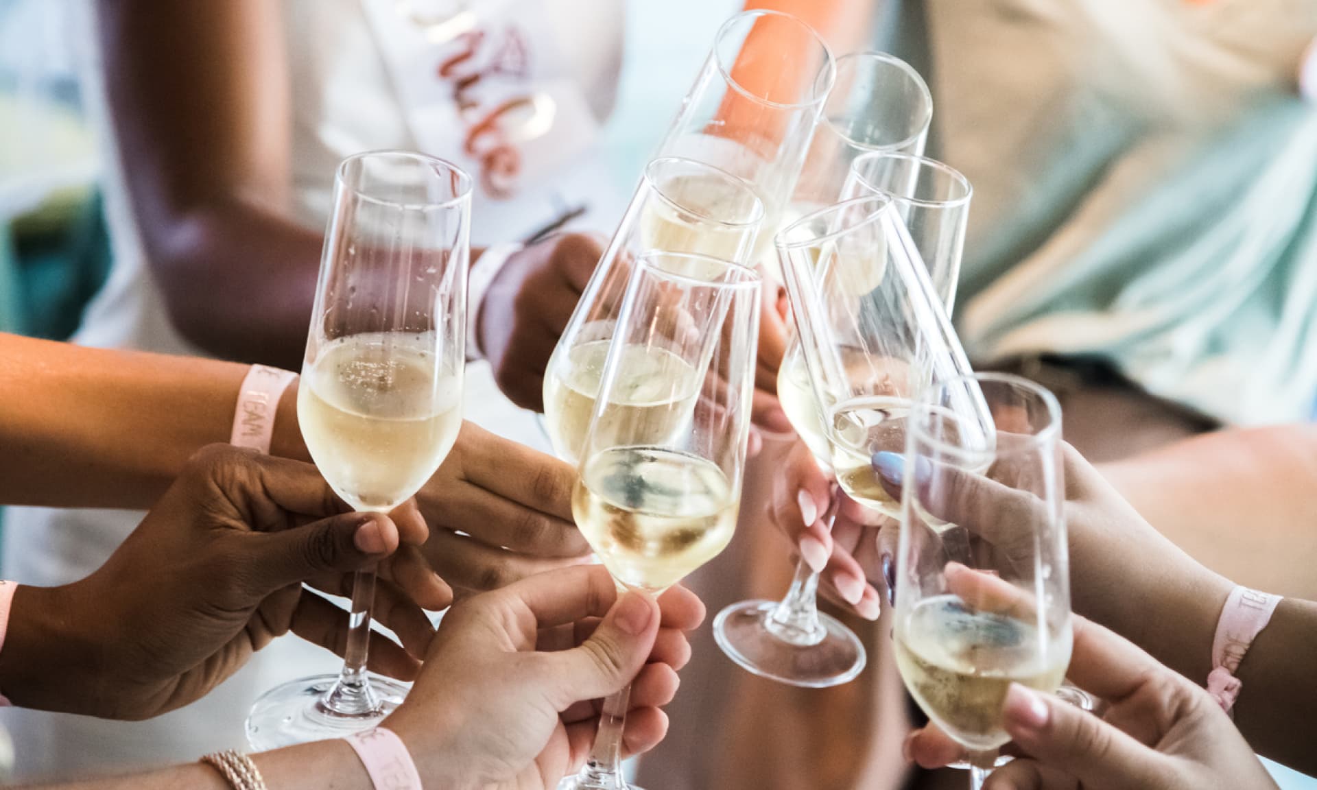 Group of women on bachelorette trip doing a toast