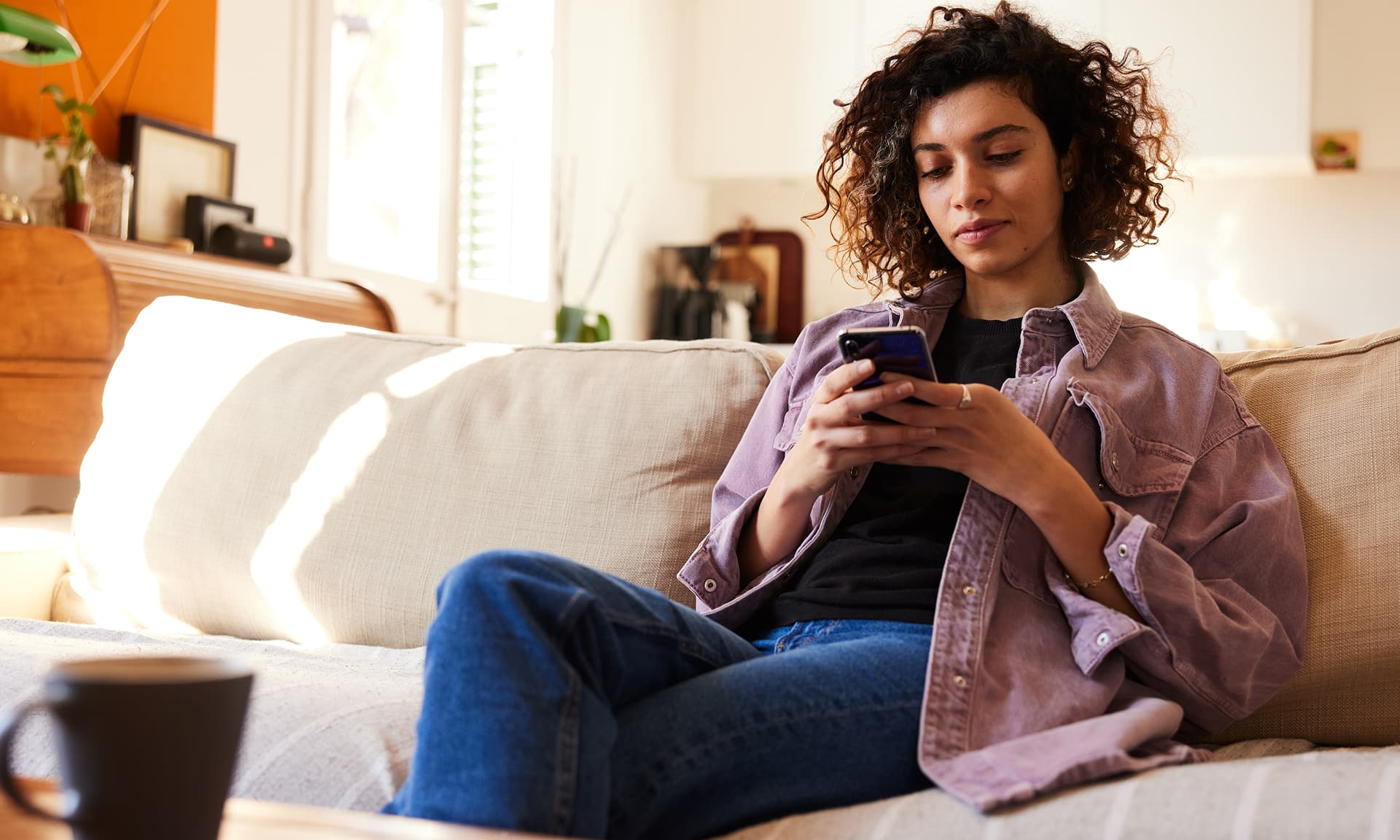 woman typing on cell phone