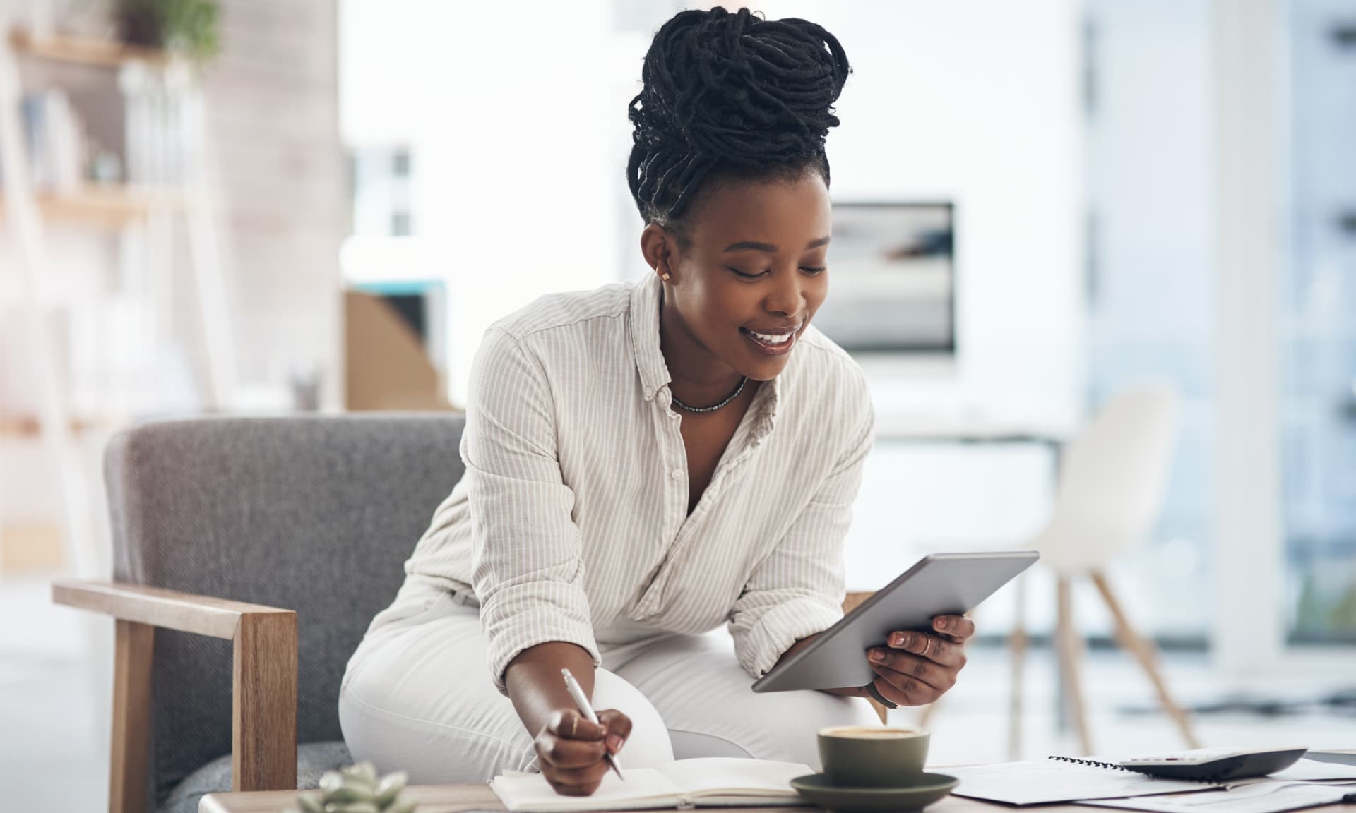 black woman looking at tablet